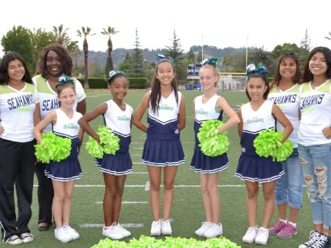 a group of cheerleaders posing for a photo