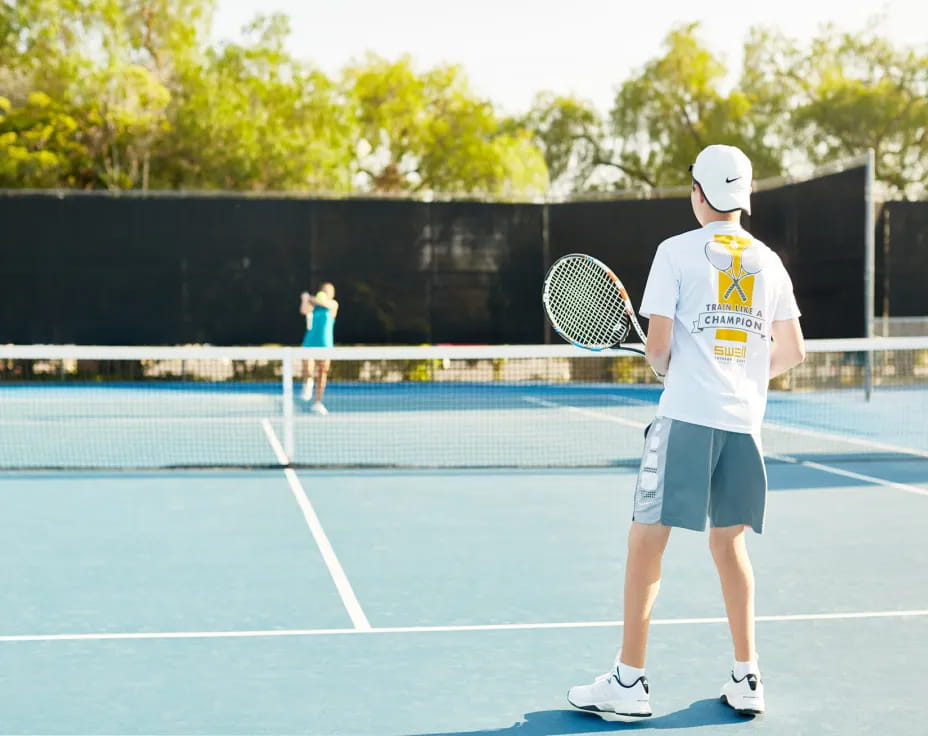 a man holding a tennis racket