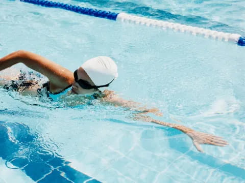 a person swimming in a pool