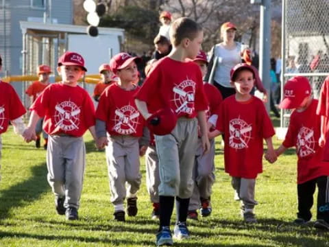 a group of kids in red shirts