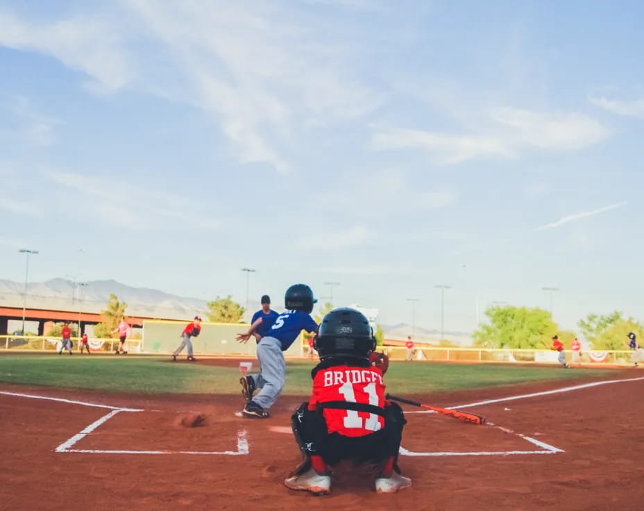 a baseball player prepares to swing a bat