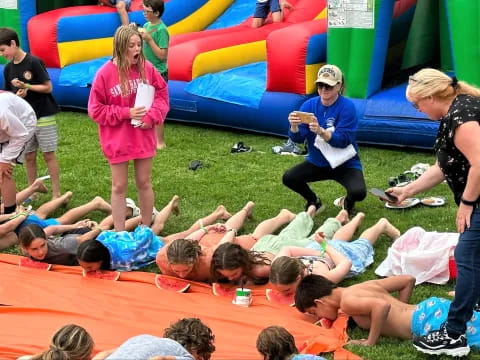 a group of people sitting on the ground