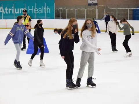 a group of people ice skating