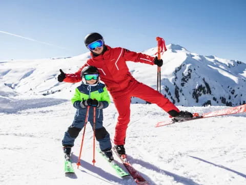 a person and a child skiing