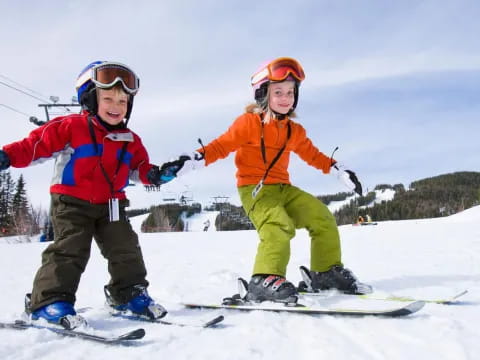 kids on snowboards in the snow