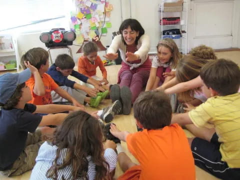 a group of children sitting in a classroom