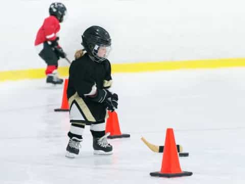 a couple of kids playing hockey