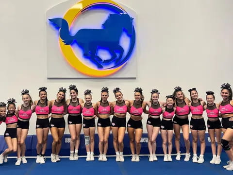 a group of girls in pink shirts