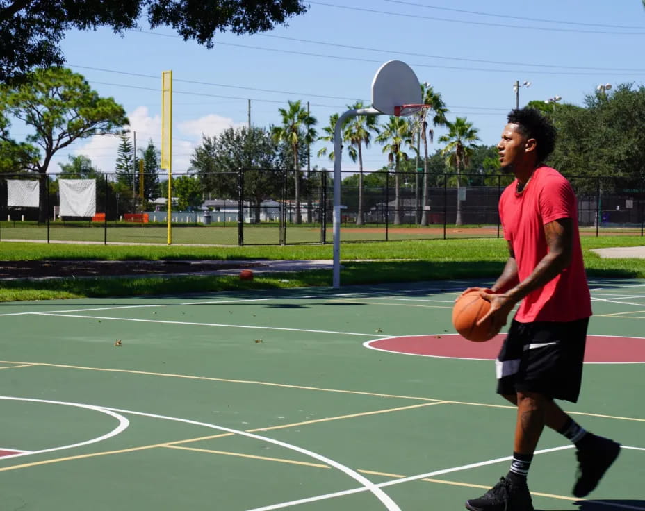 a person holding a basketball