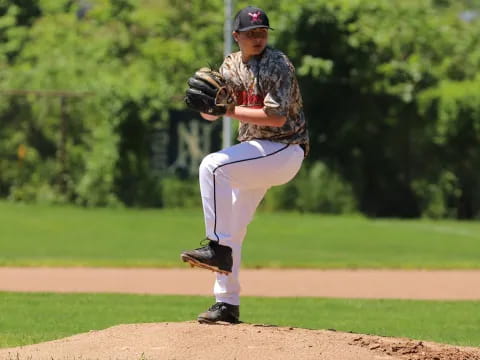 a baseball player throwing a ball