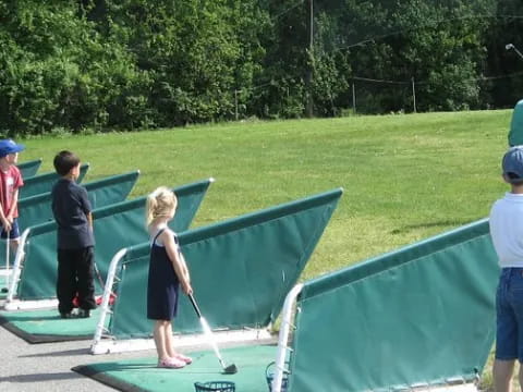 a group of people playing golf