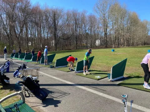 a group of people playing golf