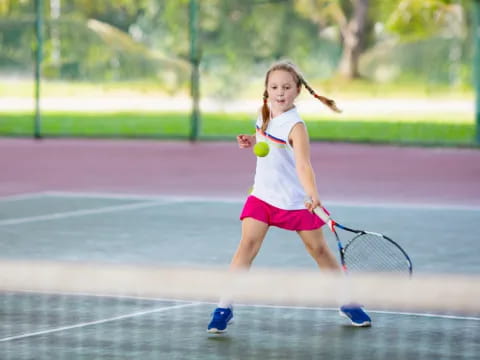 a girl playing tennis