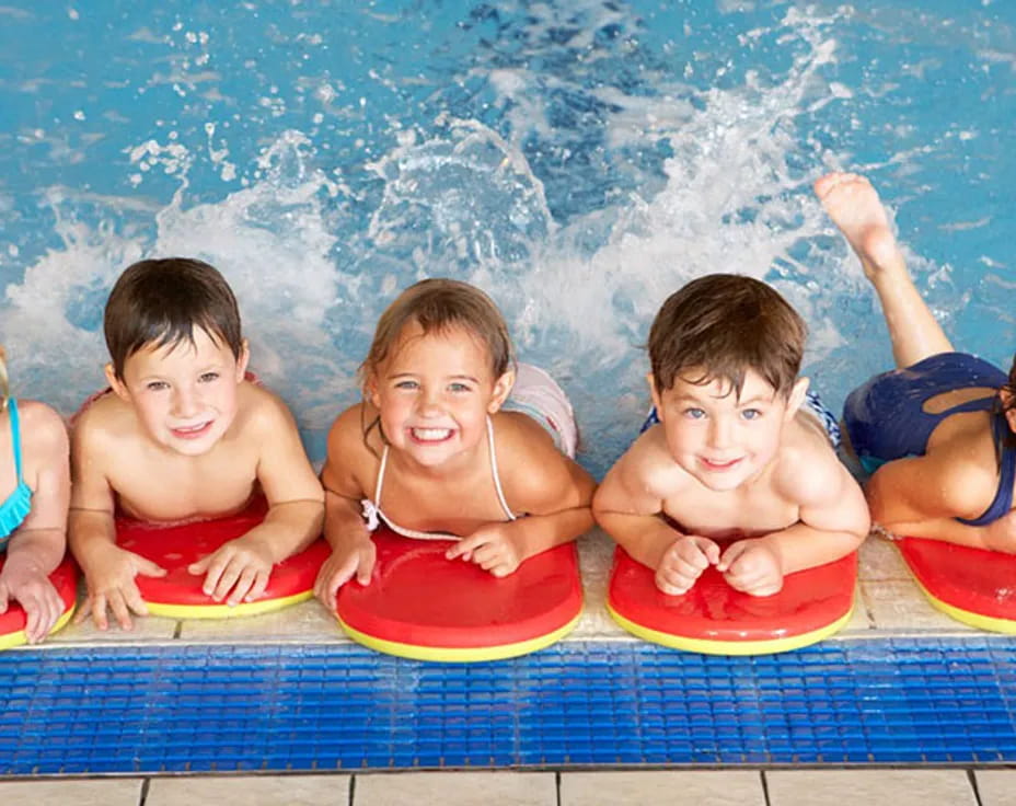 a group of kids in a pool