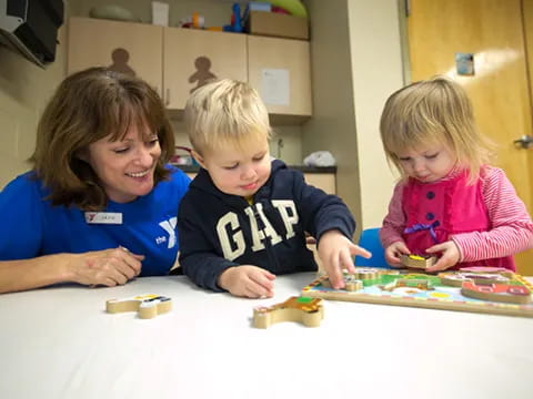 a group of children playing with blocks