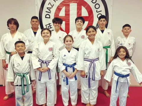 a group of people in karate uniforms