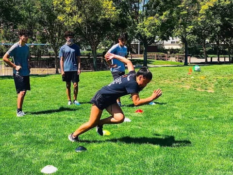 a group of people playing frisbee