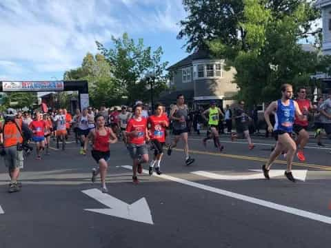 a group of people running on a street