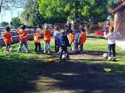 a group of kids playing football