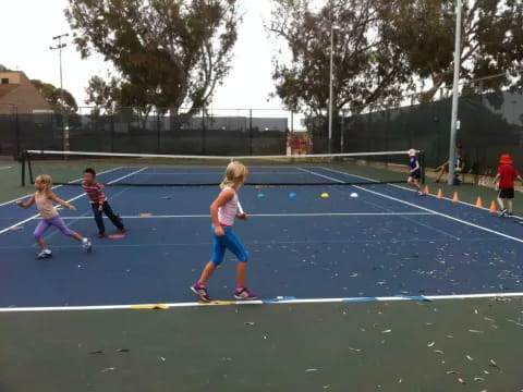 a group of kids playing a sport