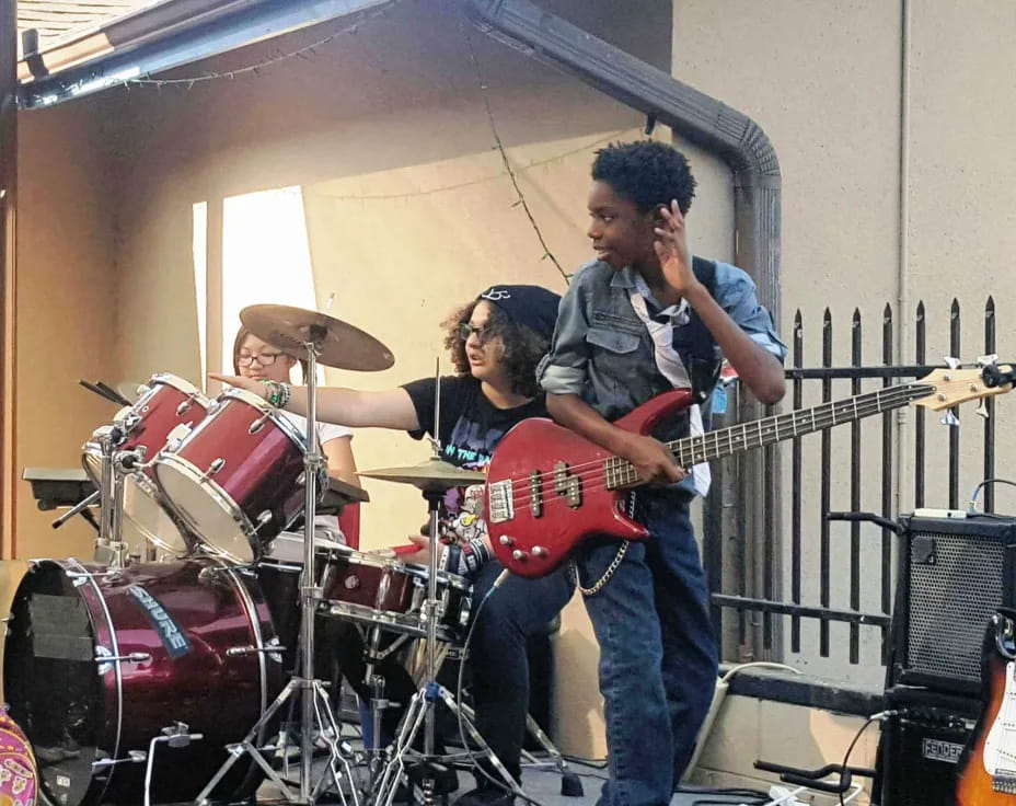 a group of people playing instruments