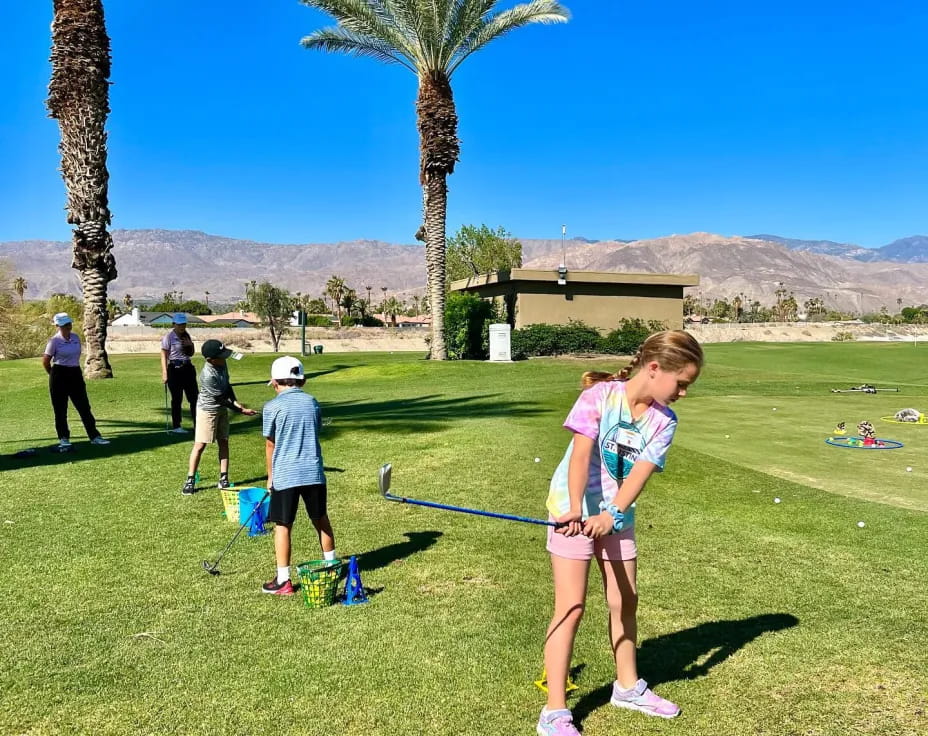 a group of people playing golf