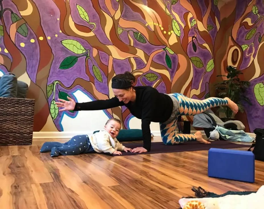 a man and a woman doing yoga