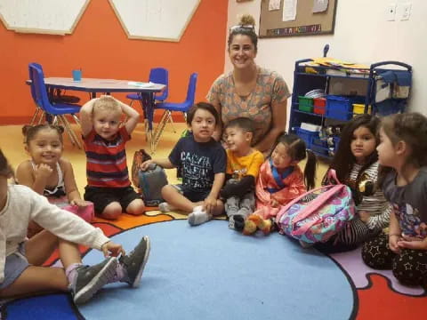 a group of children sitting on the floor