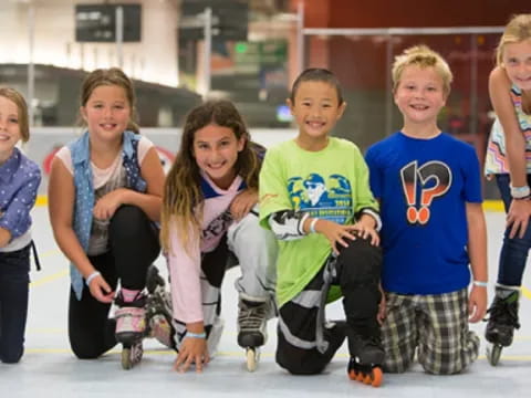 a group of kids wearing roller skates
