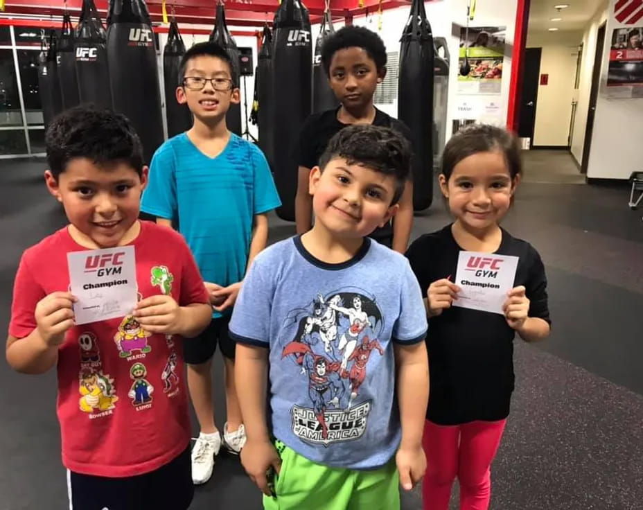 a group of children holding signs