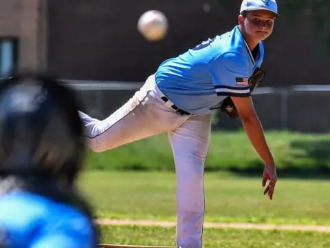 a baseball player throwing a ball