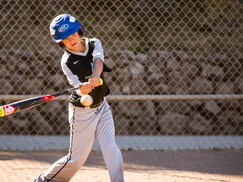 a young boy playing baseball