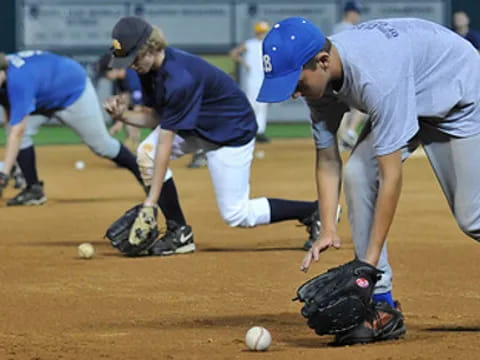 a baseball player about to catch a ball