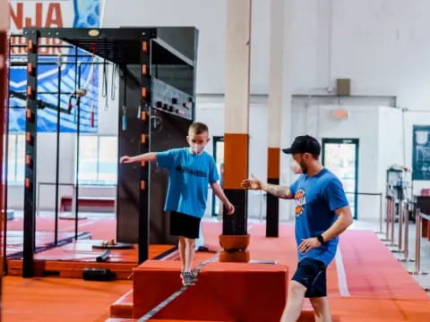 a person and a boy working out