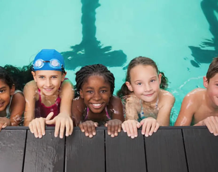 a group of children in a pool