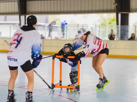 a group of people playing hockey