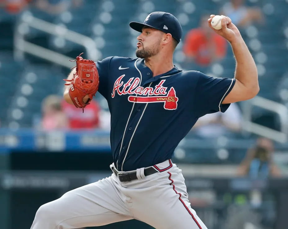 a baseball player throwing a ball