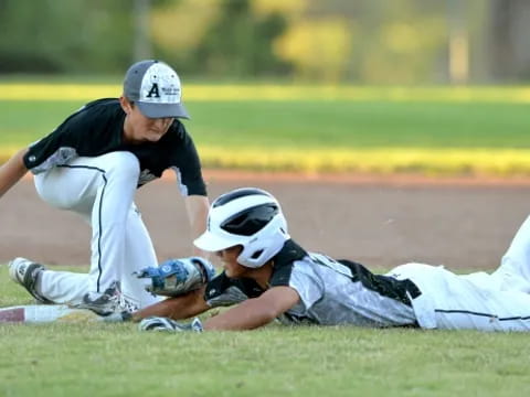 a man sliding on a baseball field