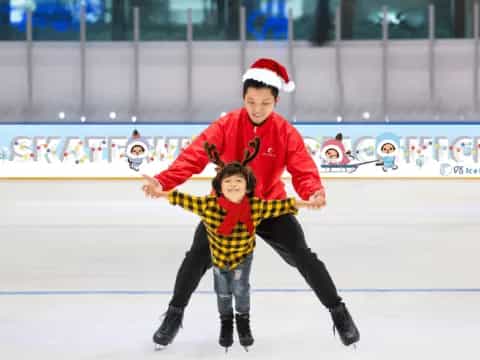 a person and a boy ice skating