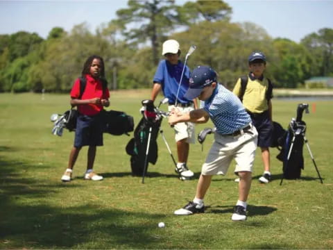 a group of people playing golf