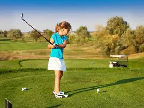 a girl playing golf