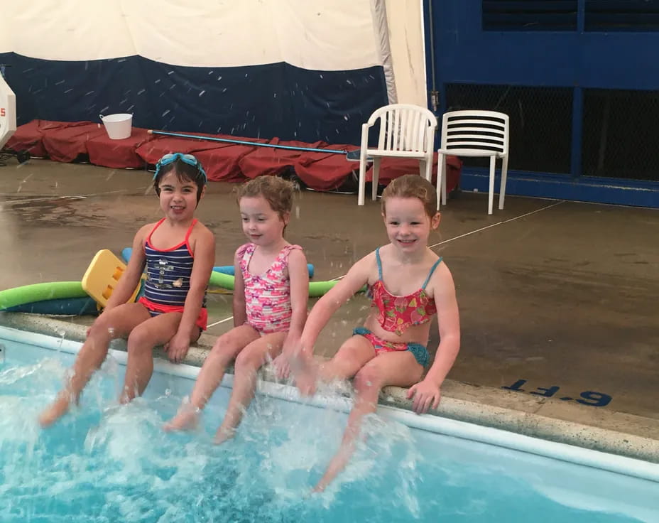 a group of children in a pool