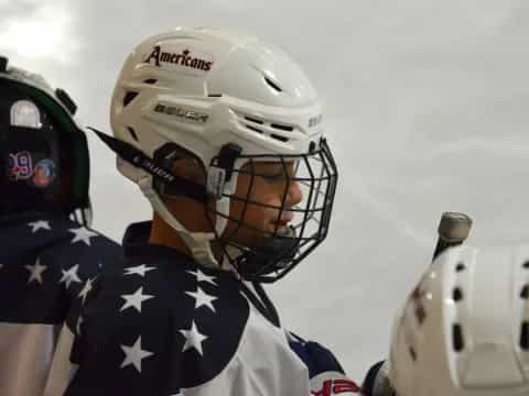 a person wearing a helmet and holding a flag