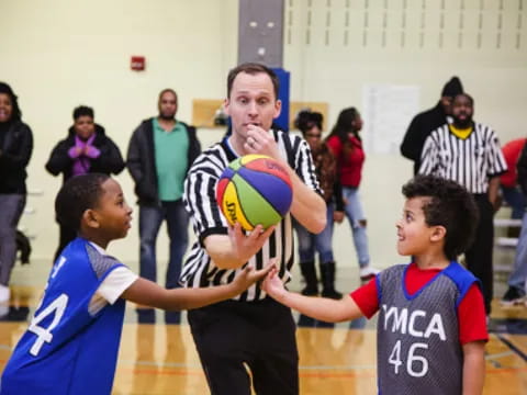 a group of boys playing basketball