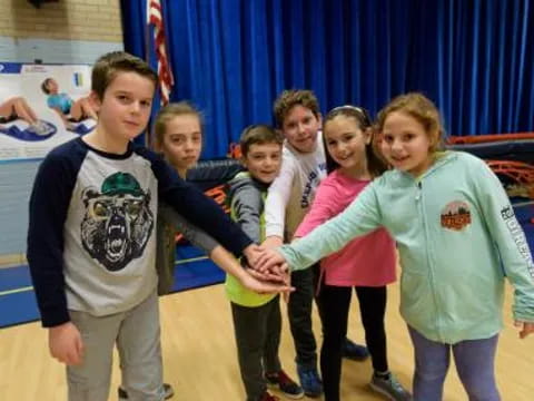 a group of children posing for a photo