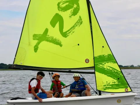 a group of people on a sailboat