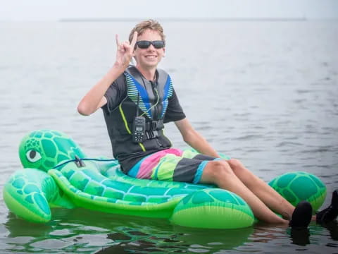 a person on a floating device in the water