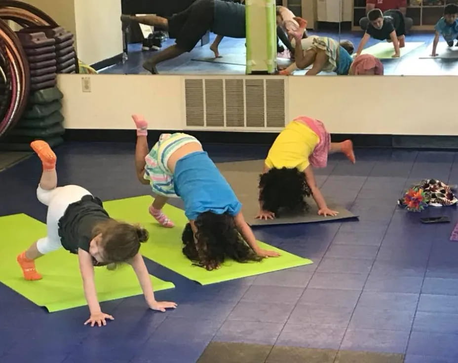 a group of women doing yoga