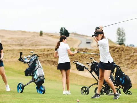 a group of women playing golf