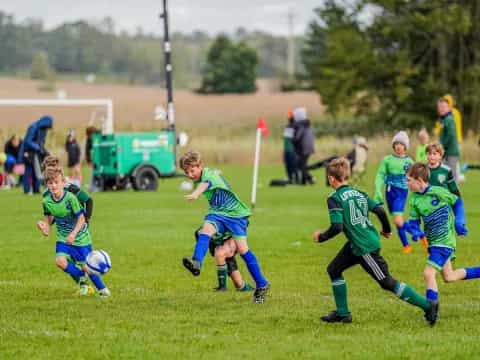 a group of kids playing football